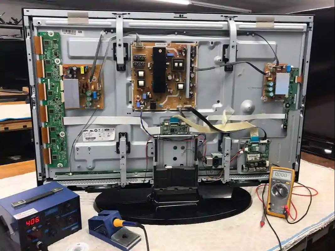 LED TV repair technician at work